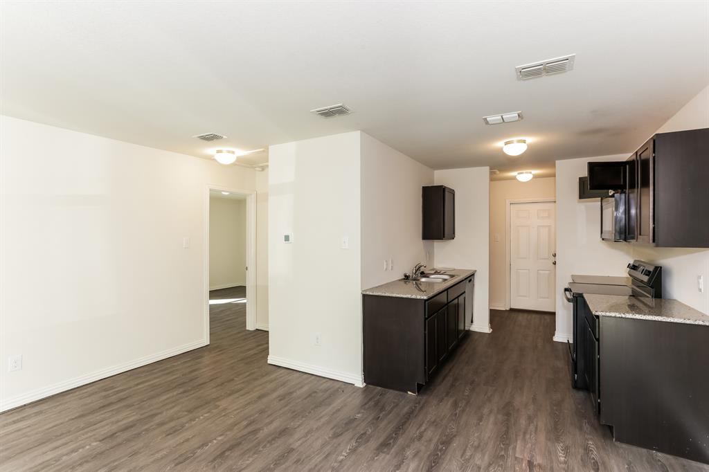 408 Jonathan Street Athens, TX 75751 - Photo 8 of 21 a view of kitchen with sink and refrigerator