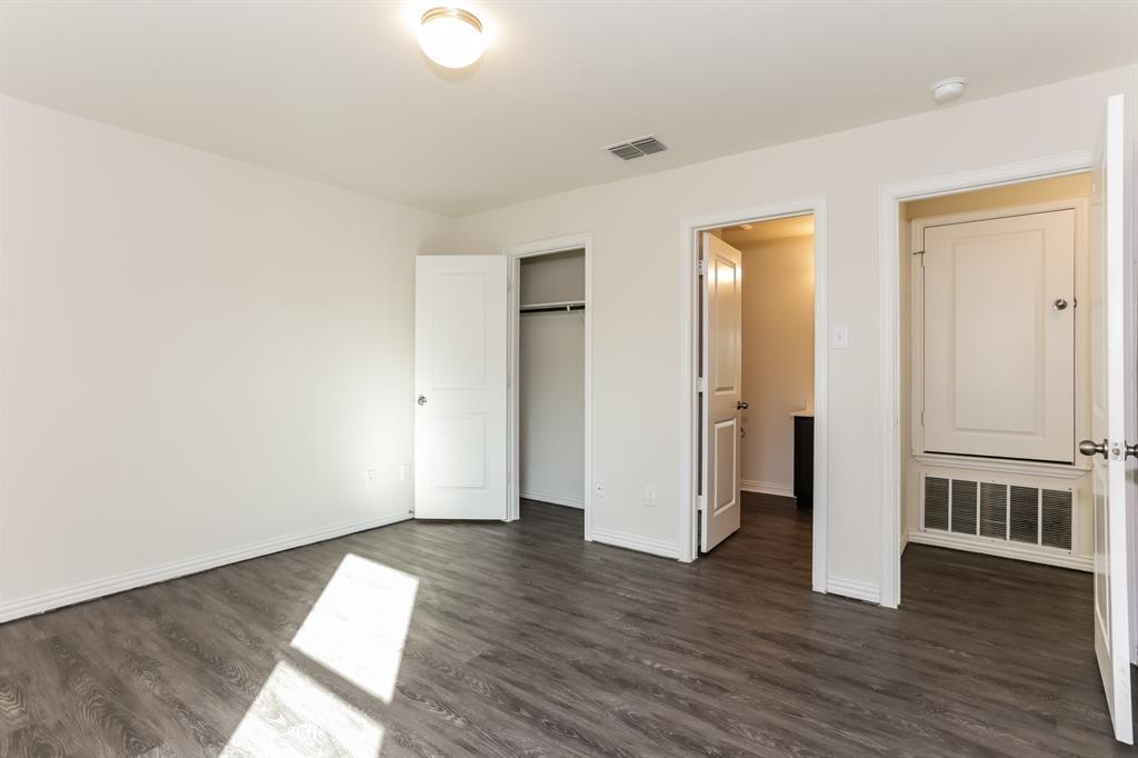 408 Jonathan Street Athens, TX 75751 - Photo 10 of 21 an empty room with wooden floor and windows