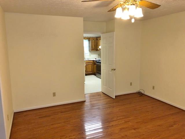 4074 Shady Grove Road Morrison, TN 37357 - Photo 12 of 29 a view of an empty room with wooden floor and a window