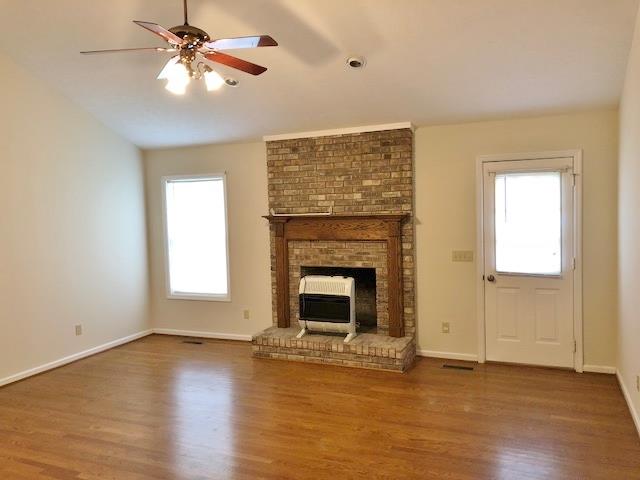 4074 Shady Grove Road Morrison, TN 37357 - Photo 5 of 29 wooden floor fireplace and windows in an empty room