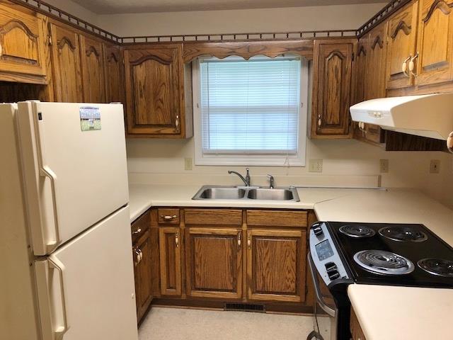 4074 Shady Grove Road Morrison, TN 37357 - Photo 8 of 29 a kitchen with a refrigerator and a sink
