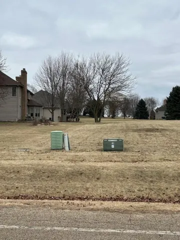 a view of a yard with swimming pool