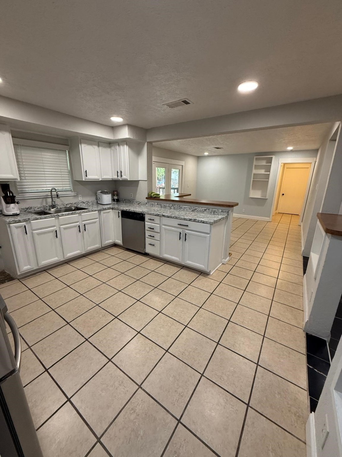 4323 Jamie Lane Houston, TX 77048 - Photo 14 of 15 a kitchen with a sink and cabinets