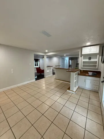 a kitchen with stainless steel appliances kitchen island granite countertop a sink and cabinets