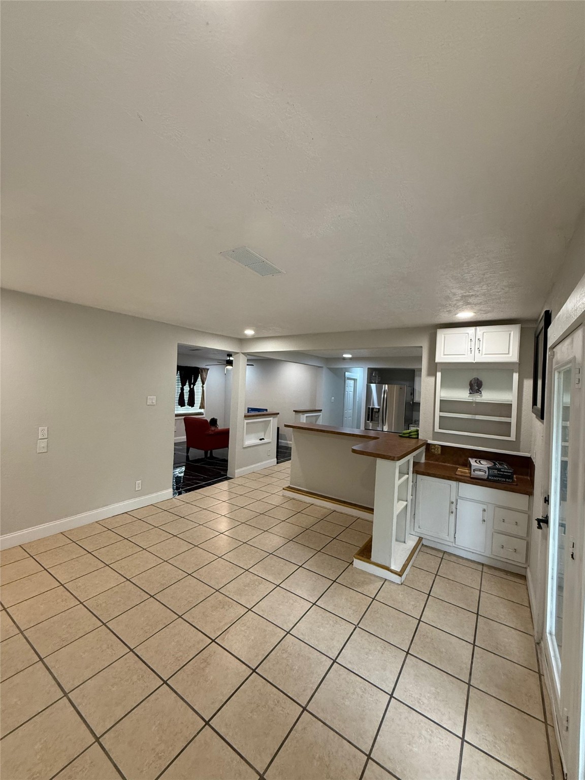 4323 Jamie Lane Houston, TX 77048 - Photo 8 of 15 a kitchen with kitchen island a stove a counter top space and cabinets
