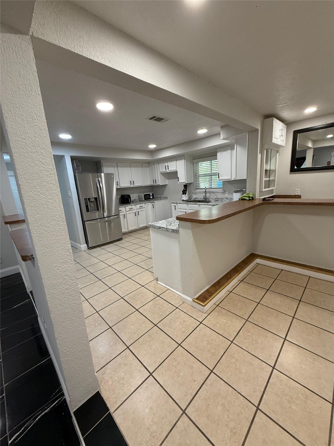 4323 Jamie Lane Houston, TX 77048 - Photo 9 of 15 a kitchen with a sink and cabinets