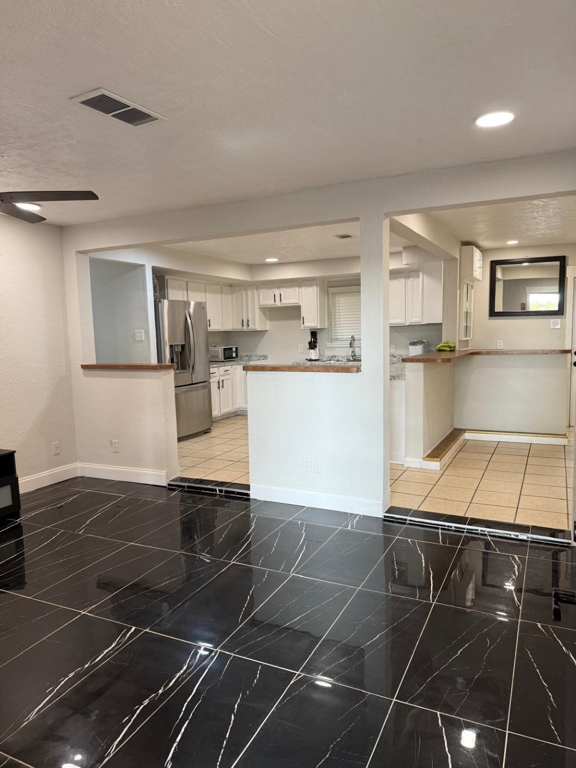 4323 Jamie Lane Houston, TX 77048 - Photo 10 of 15 a room with a wooden floor and white appliances