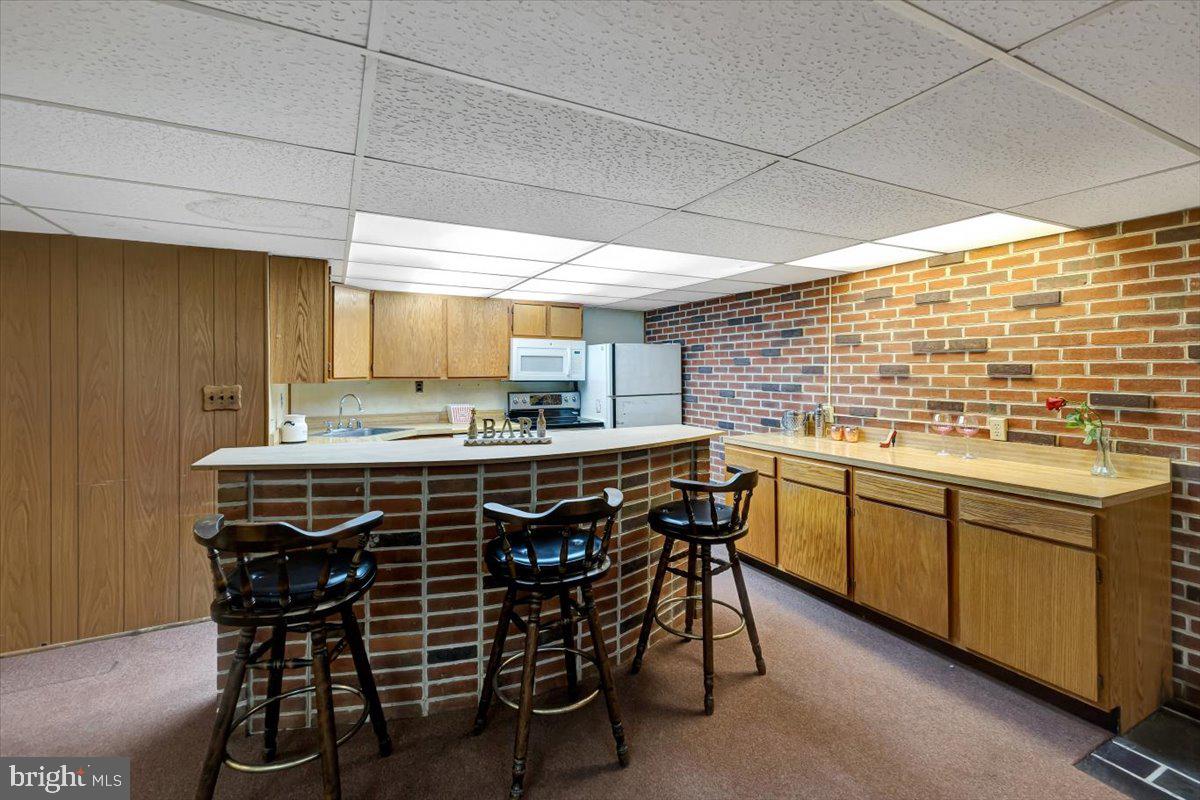 3854 Terka Circle Randallstown, MD 21133 - Photo 18 of 19 a kitchen with stainless steel appliances a sink and cabinets