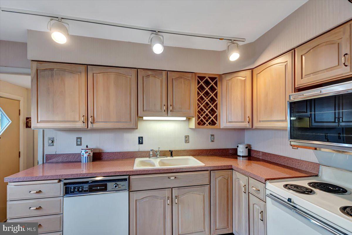 3854 Terka Circle Randallstown, MD 21133 - Photo 7 of 19 a kitchen with a sink cabinets and window