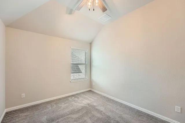 an empty room with a empty space and windows