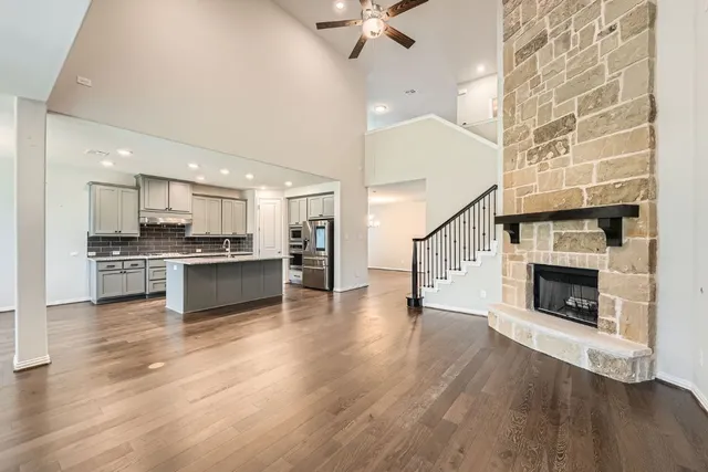 a view of kitchen and kitchen with granite countertop a stove top oven