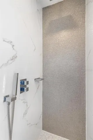 a bathroom with a bathtub and a window