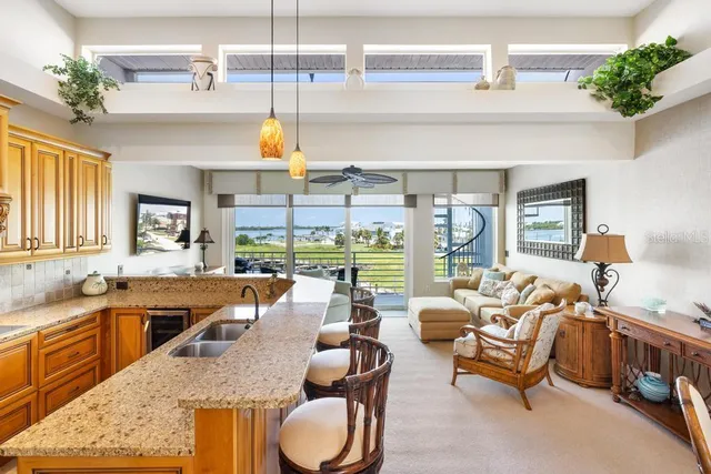 an entryway and livingroom with furniture