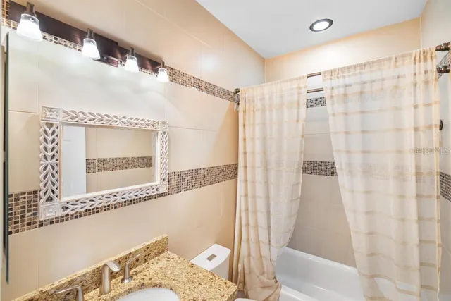 a view of a lake with couches chairs