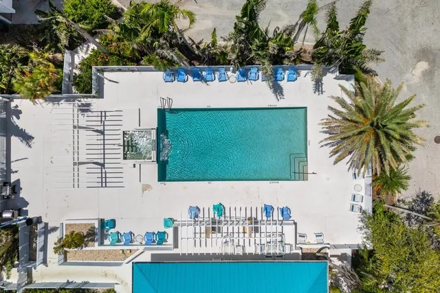 an aerial view of a house with a lake view