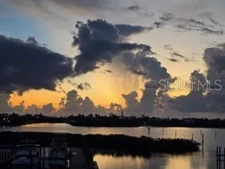 a view of a lake with mountain in the background