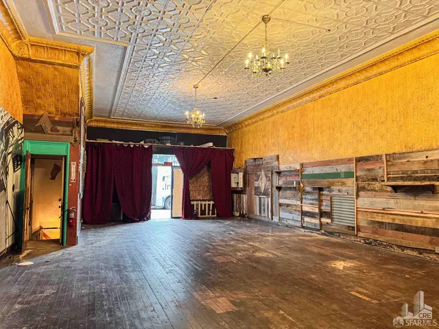 a view of a room with a balcony and furniture