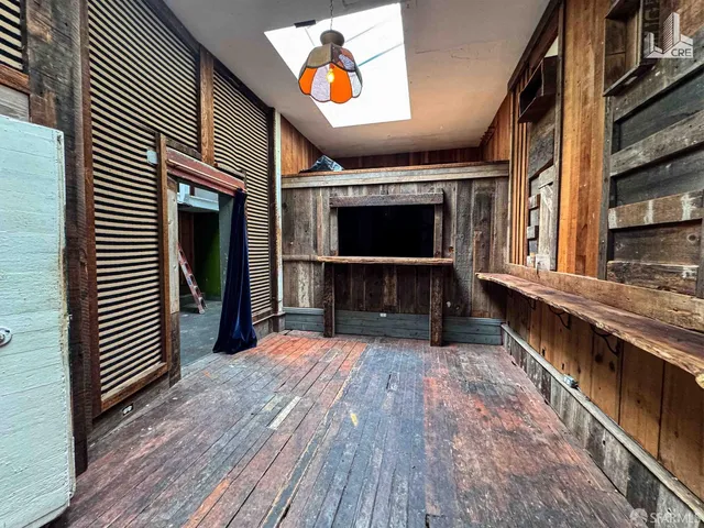 a view of a porch with wooden floor and flat screen tv