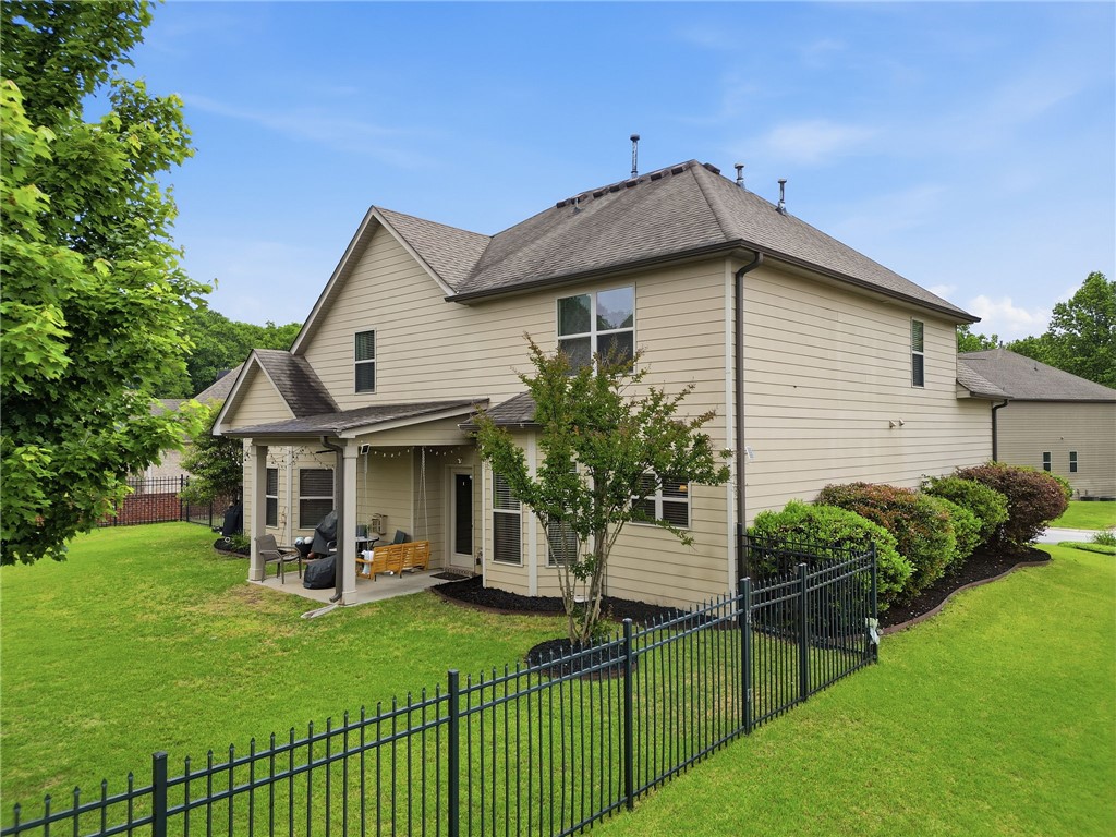 138 Buckland Drive Anderson, SC 29621 - Photo 43 of 49 This spacious residence boasts a meticulously maintained lawn and a welcoming patio.