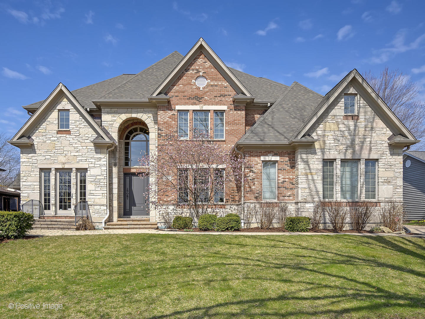 1129 Summit Hills Lane Naperville, IL 60563 - Photo 1 of 72 a front view of a house with a yard