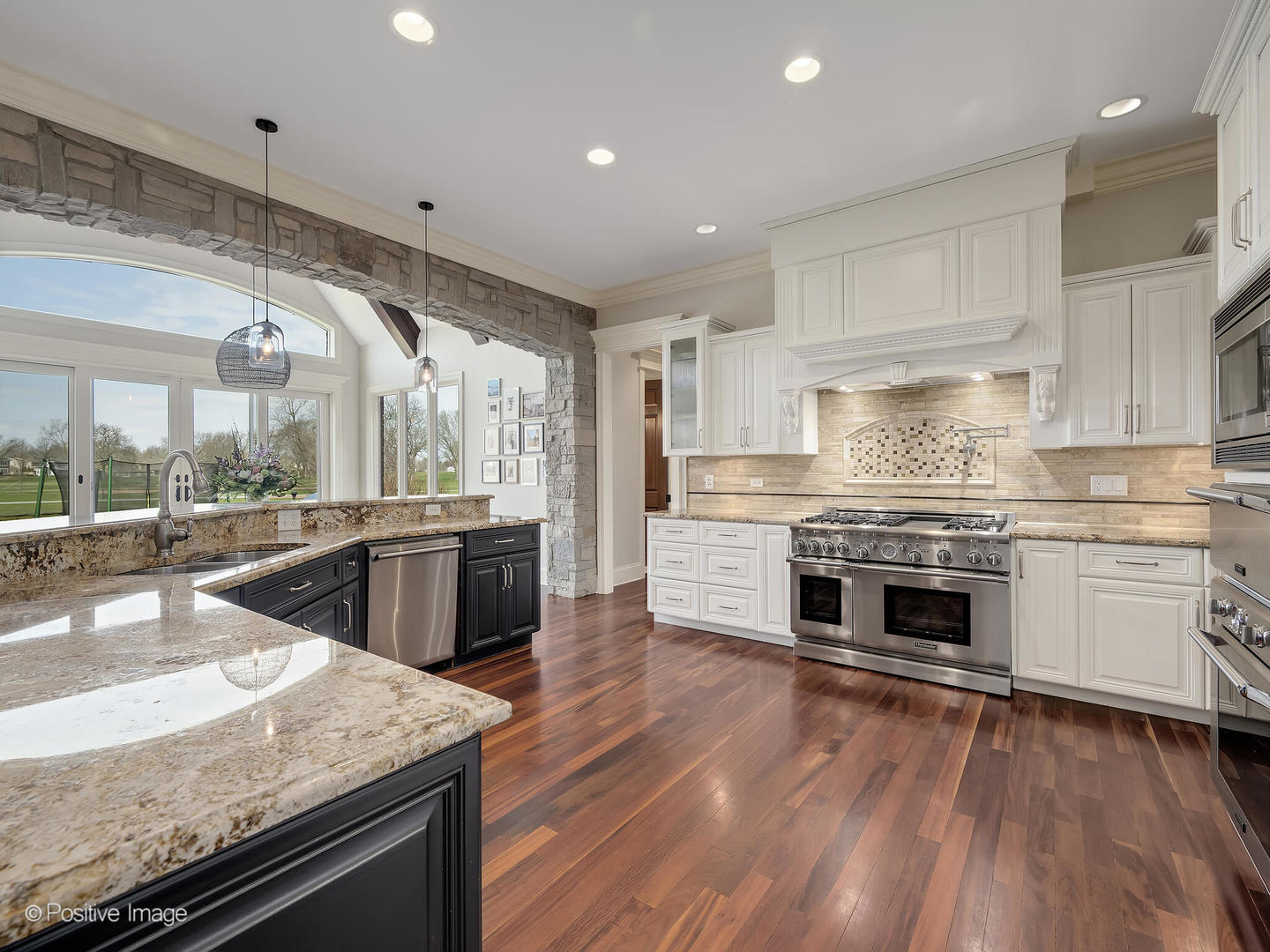 1129 Summit Hills Lane Naperville, IL 60563 - Photo 17 of 72 a kitchen with stainless steel appliances granite countertop a stove and a sink
