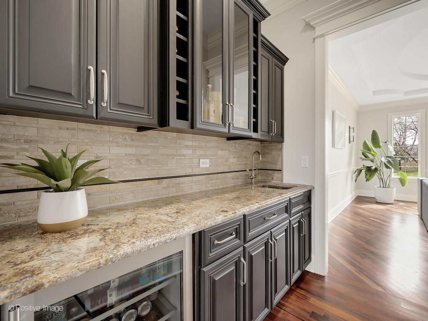 1129 Summit Hills Lane Naperville, IL 60563 - Photo 23 of 72 a kitchen with stainless steel appliances granite countertop a sink and a wooden floor
