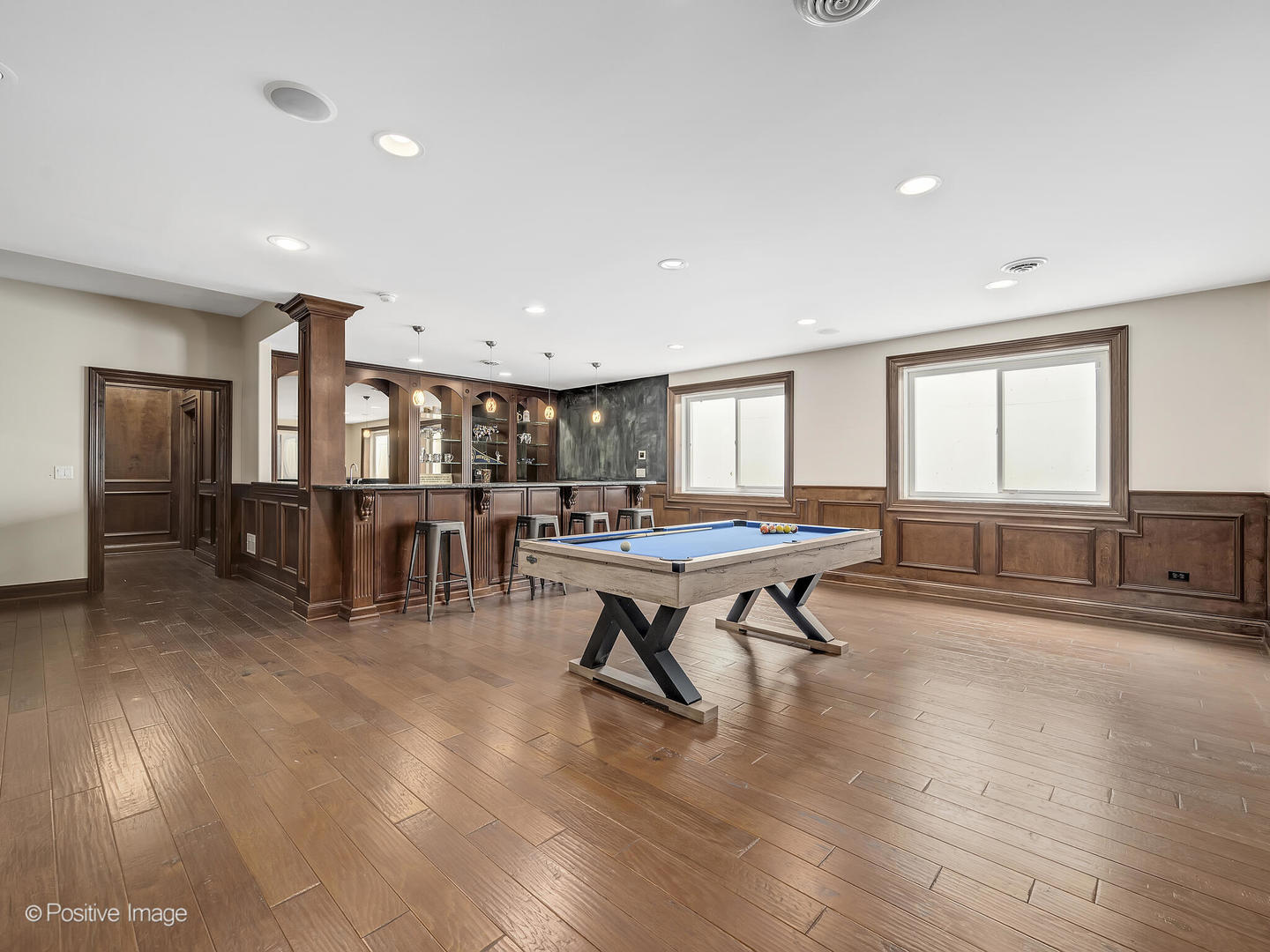 1129 Summit Hills Lane Naperville, IL 60563 - Photo 45 of 72 a living room with furniture a table and wooden floor