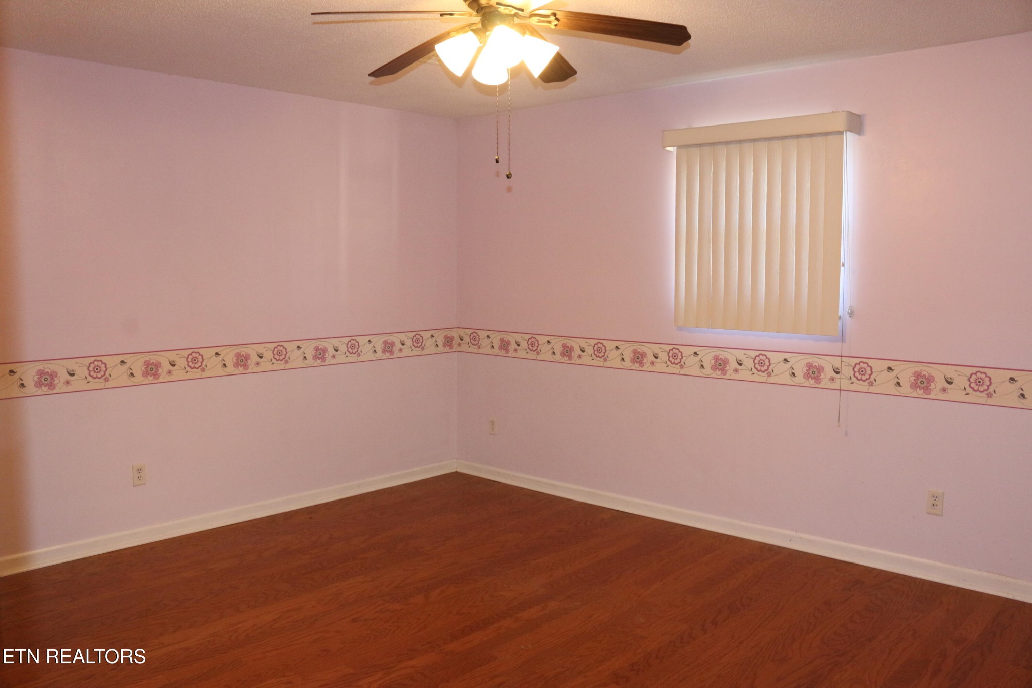 153 Vanderview Drive Seymour, TN 37865 - Photo 11 of 22 a view of a room with wooden floor and fan