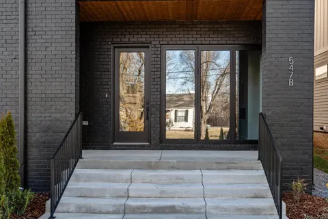 a front view of a house with a porch