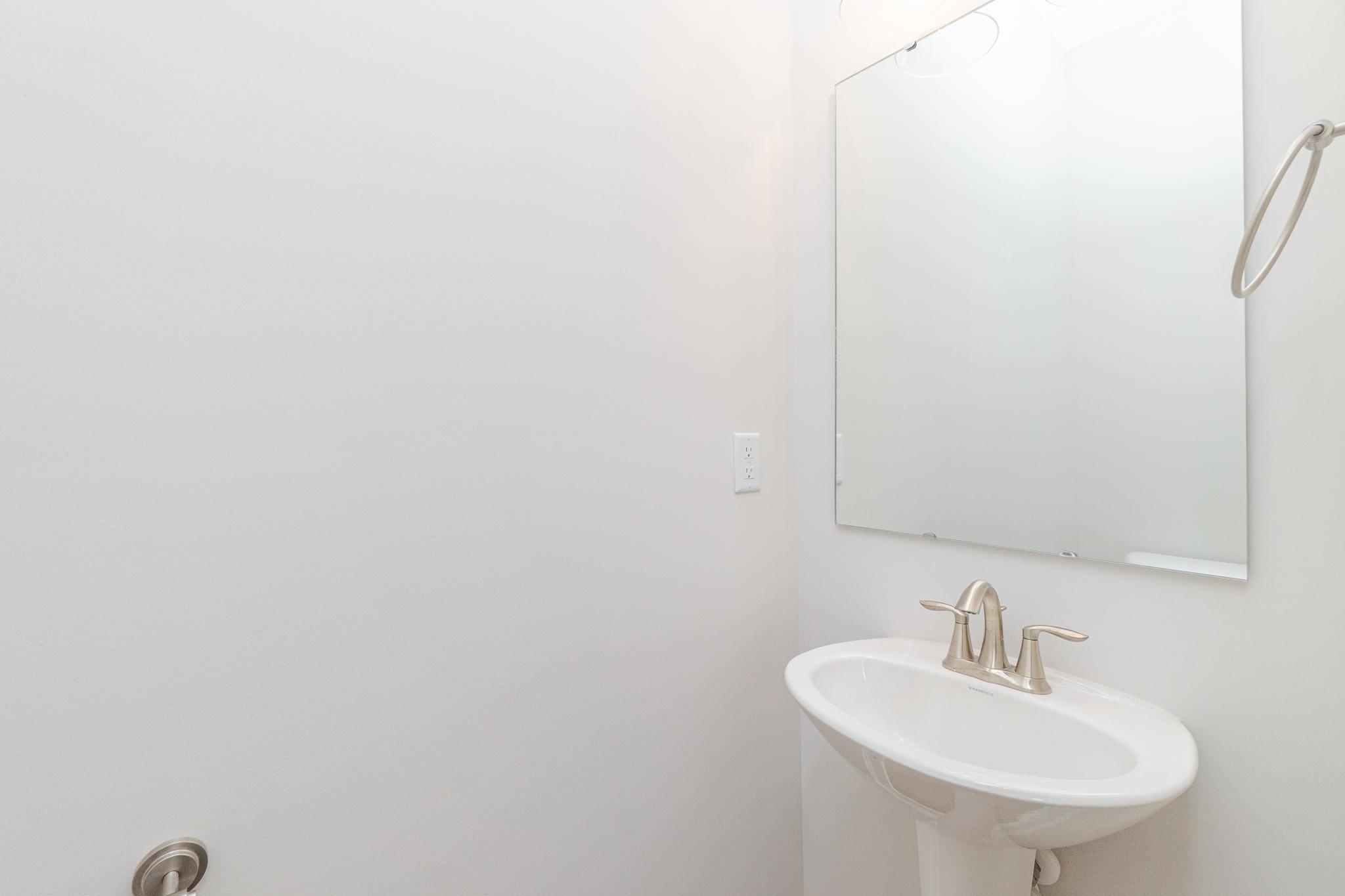 4916 Trek Lane Raleigh, NC 27606 - Photo 11 of 28 a bathroom with a sink and a mirror