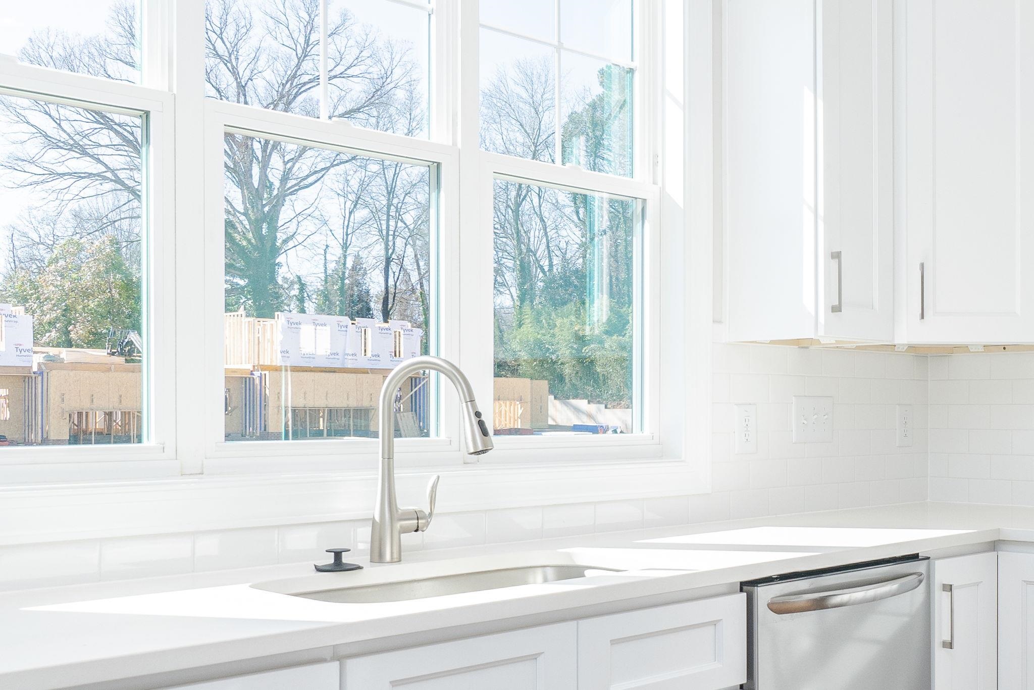 4916 Trek Lane Raleigh, NC 27606 - Photo 16 of 28 a kitchen with a sink and a window