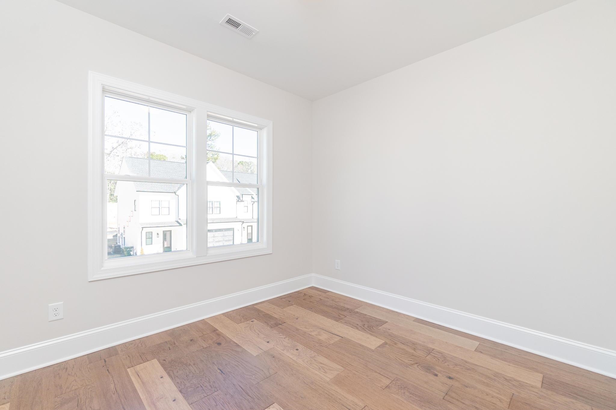 4916 Trek Lane Raleigh, NC 27606 - Photo 23 of 28 an empty room with a window