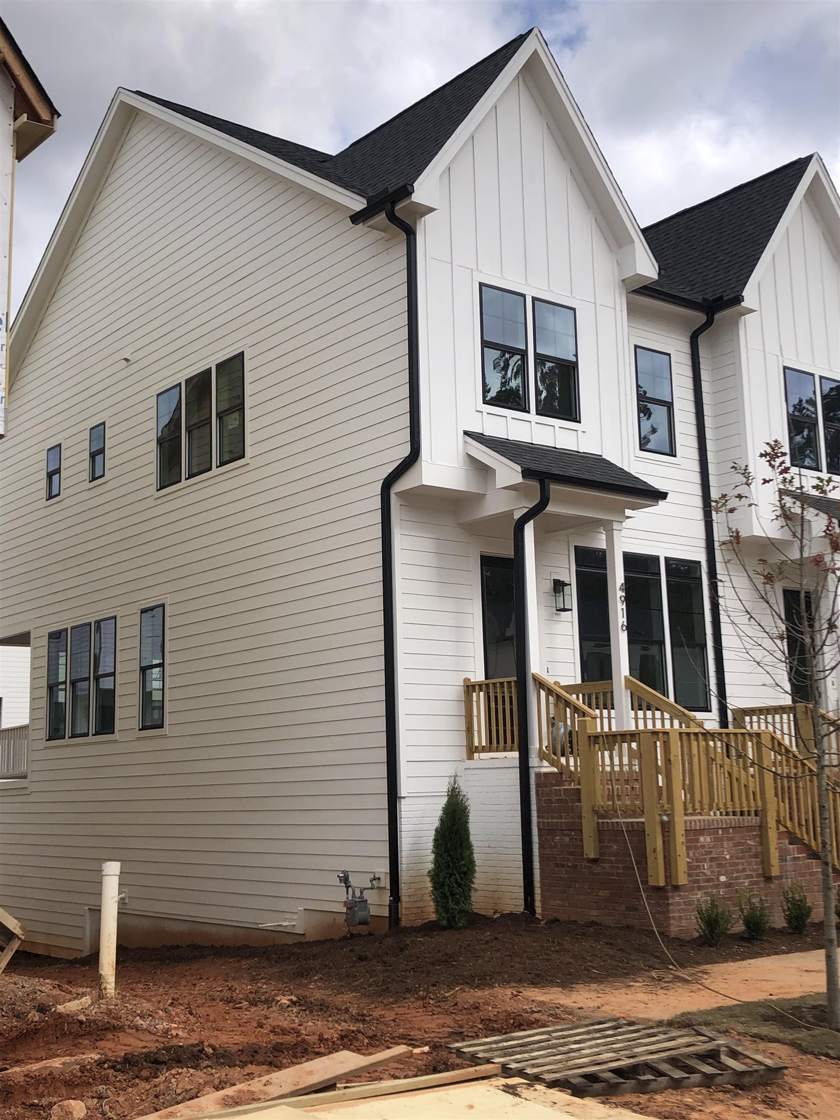 4916 Trek Lane Raleigh, NC 27606 - Photo 3 of 28 a front view of a house with a garage