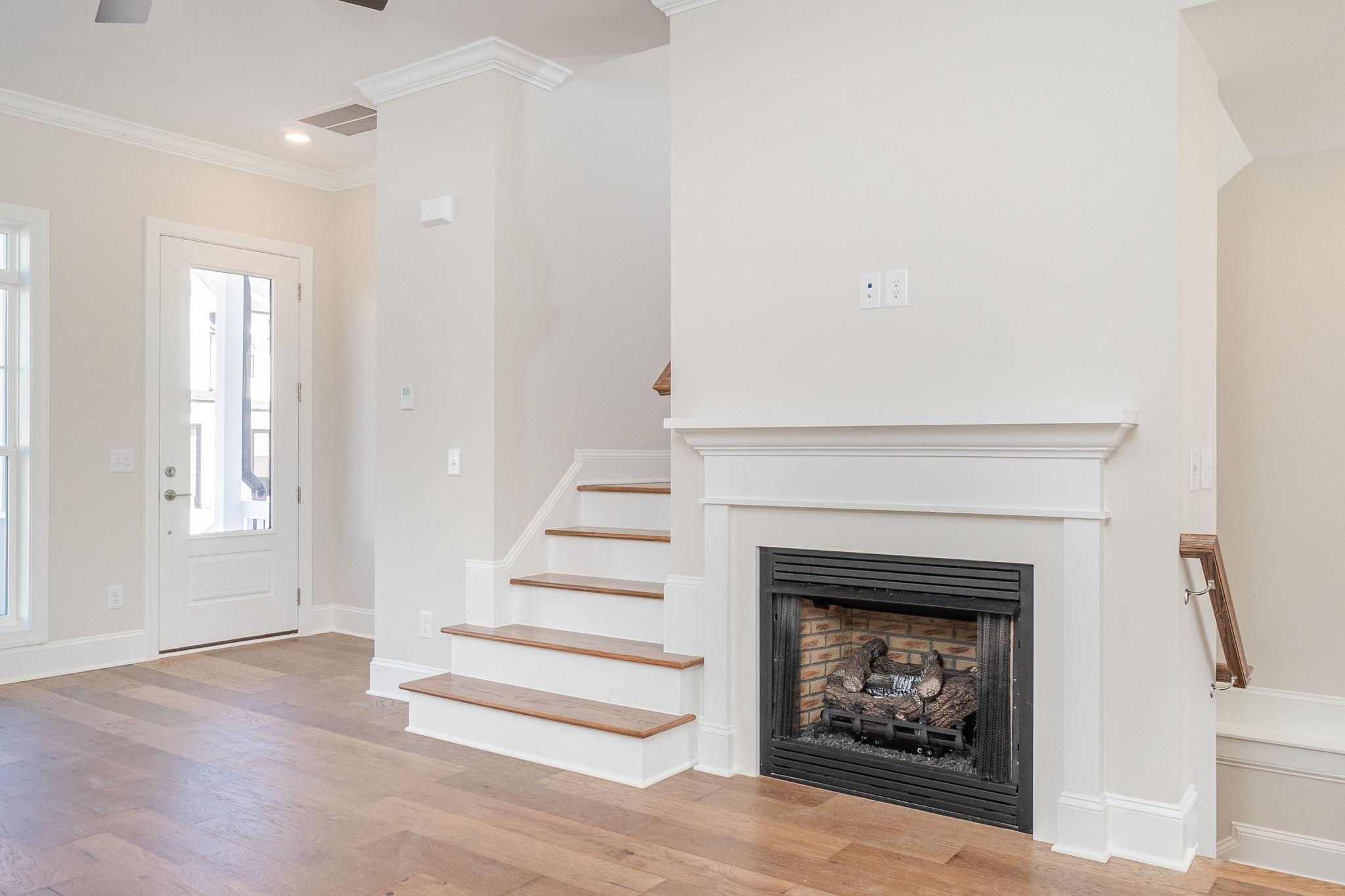 4916 Trek Lane Raleigh, NC 27606 - Photo 8 of 28 a living room with furniture and a fireplace