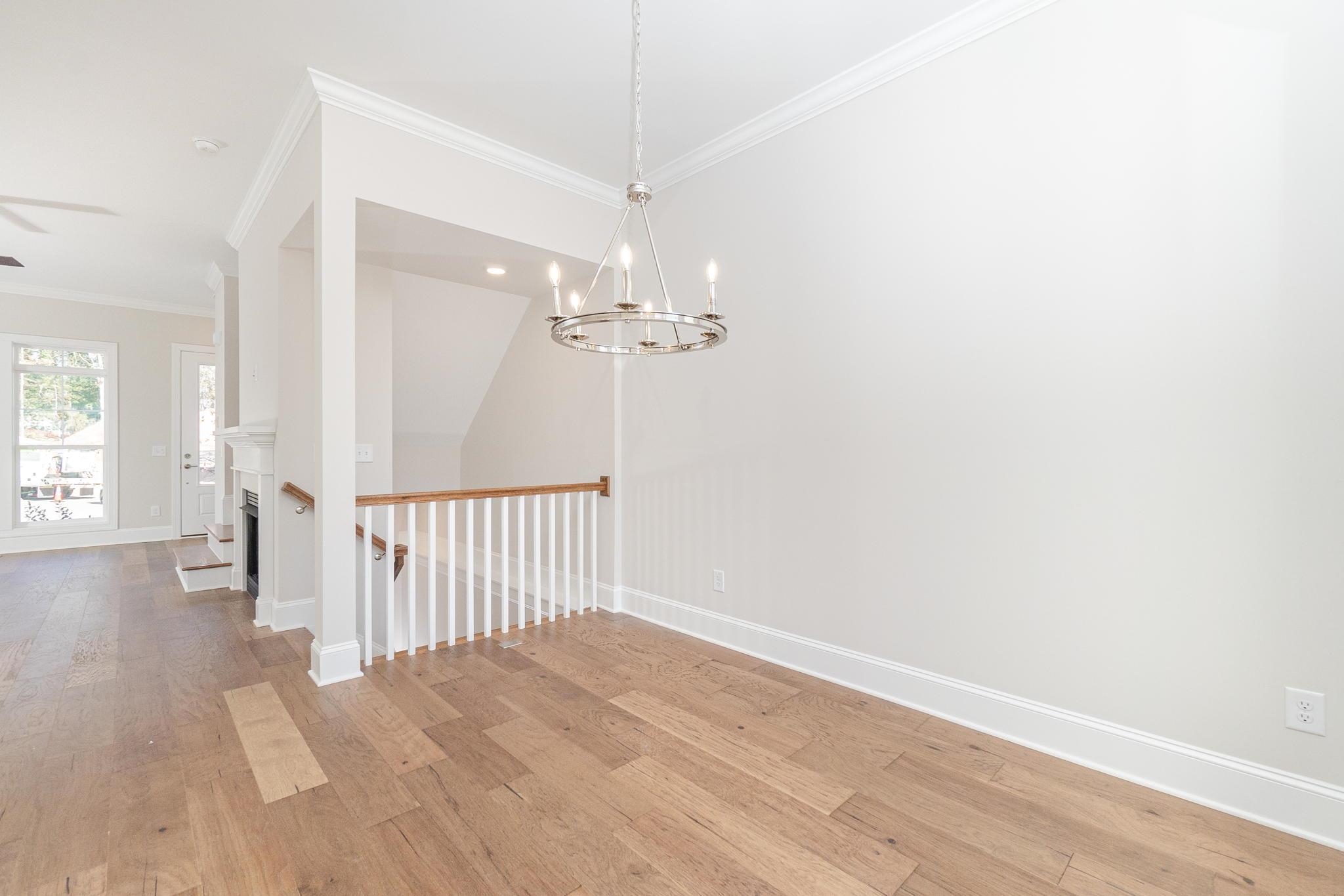4916 Trek Lane Raleigh, NC 27606 - Photo 10 of 28 a view of a chandelier fan and entryway