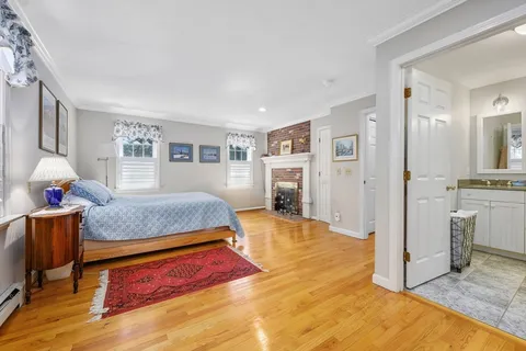 a bedroom with a bed and cabinets