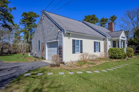 a house with garden in front of it
