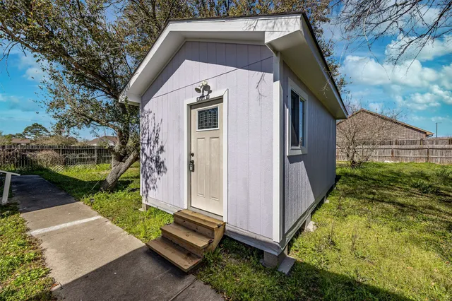 a aerial view of a house with a yard