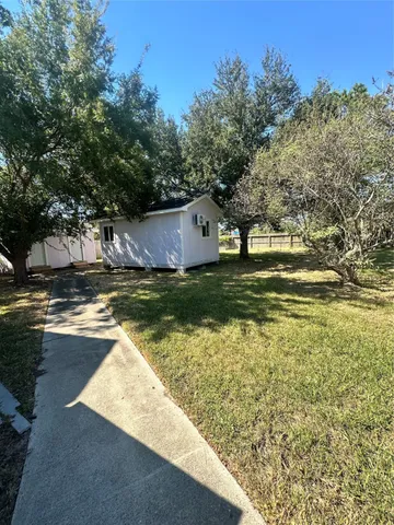 a view of a swimming pool with an outdoor space