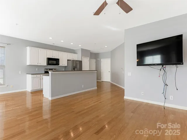 a view of a kitchen with microwave and cabinets