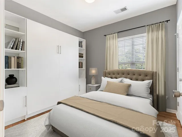 a bedroom with a bed and a book shelf