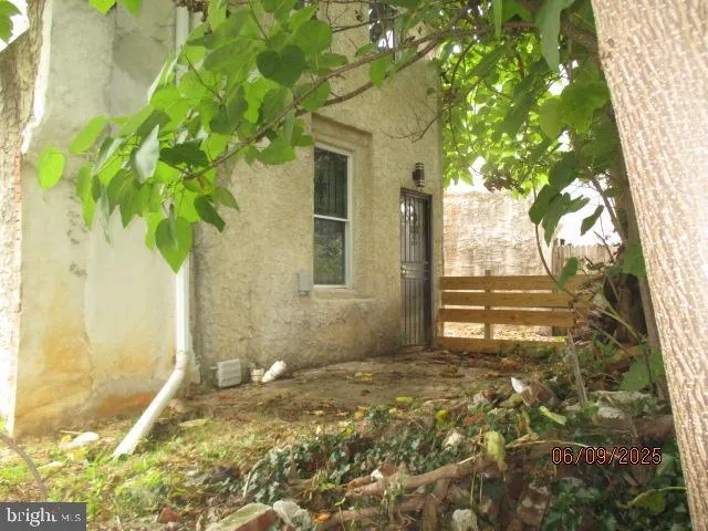 a view of a house with a tree