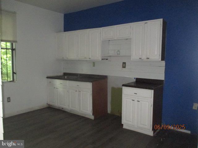 1142 West Nevada Street Philadelphia, PA 19133 - Photo 8 of 16 a kitchen with a white cabinets and a stove