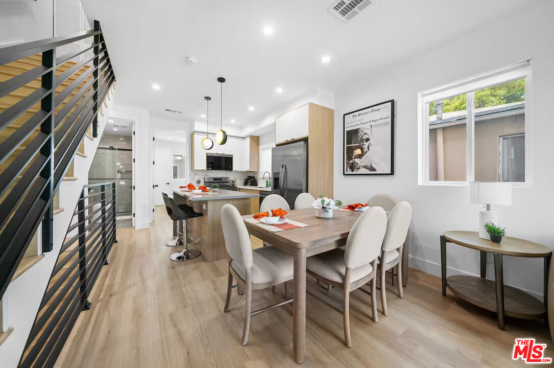 201 South Westlake Avenue, Unit 203 1/2 Los Angeles, CA 90057 - Photo 11 of 27 a view of a dining room with furniture