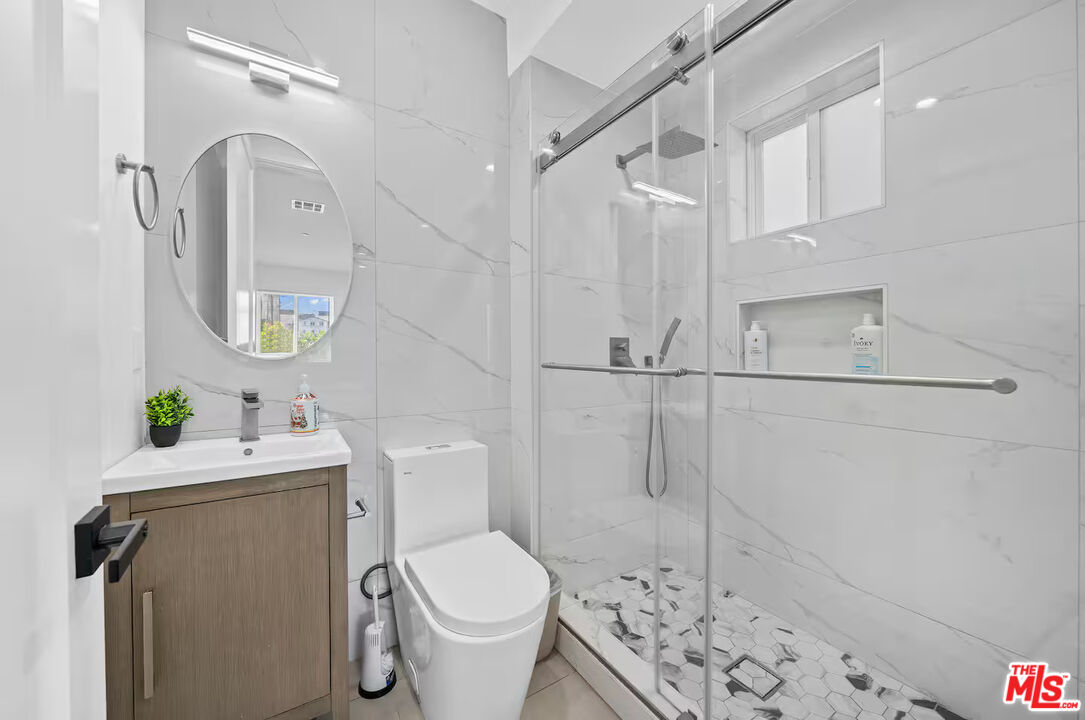 201 South Westlake Avenue, Unit 203 1/2 Los Angeles, CA 90057 - Photo 20 of 27 a bathroom with a sink toilet and shower