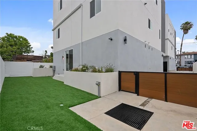 a view of room with stairs and mirrors