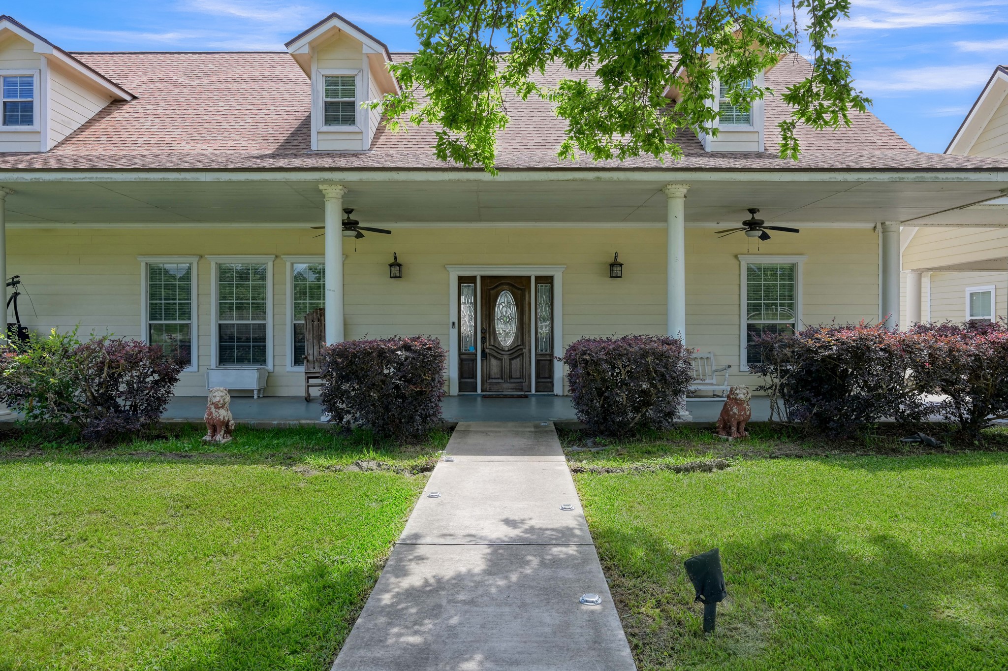 144 Wood Farm Road Huntsville, TX 77320 - Photo 2 of 35 a view of a house with garden and porch