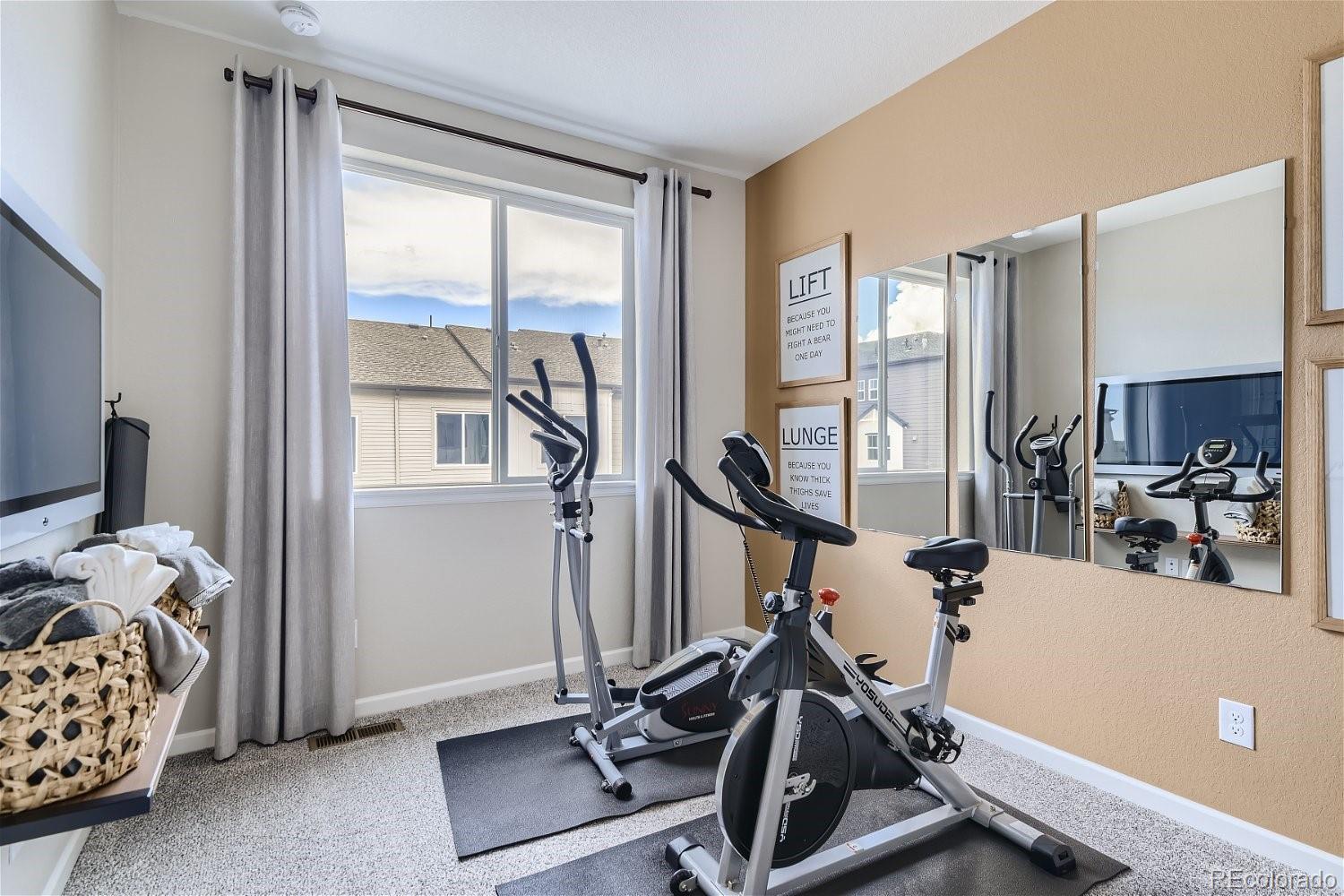 450 Millwall Circle Castle Pines, CO 80108 - Photo 18 of 23 a view of a room with gym equipment