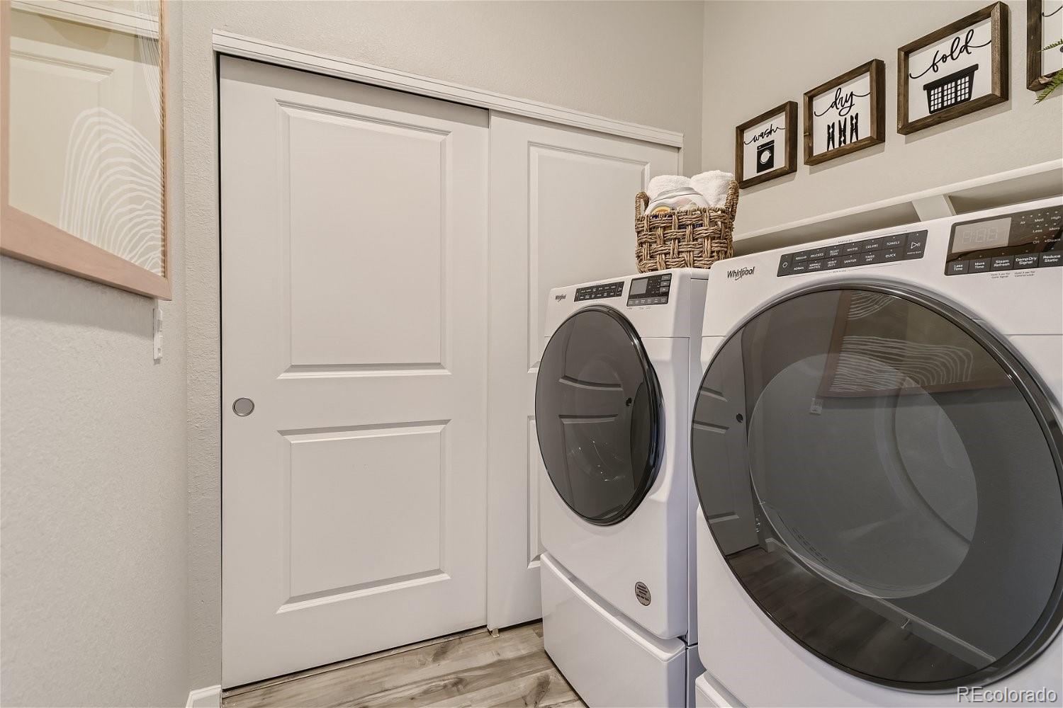 450 Millwall Circle Castle Pines, CO 80108 - Photo 22 of 23 a utility room with dryer and washer