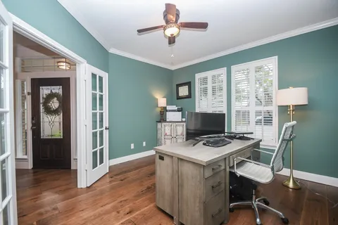 a large kitchen with stainless steel appliances kitchen island granite countertop a sink and cabinets